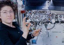 Christina Koch assists with a hardware upgrade for NASA's Cold Atom Lab