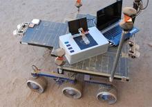 Image of Researchers took the Chemical Laptop to JPL's Mars Yard, where they placed the device on a test rover. This image shows the size comparison between the Chemical Laptop and a regular laptop