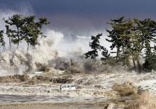Tsunami waves hitting the coast of Minamisoma in Fukushima prefecture, Japan
